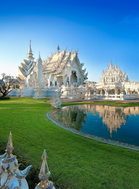 Wat-Rong-Khun-White-Temple-Chiang-Rai This image shows the stunning Wat Rong Khun, also known as the White Temple in Chiang Rai. The temple’s pure white design symbolizes purity and spirituality, with intricate artwork and sculptures that make it a must-visit landmark in Thailand.