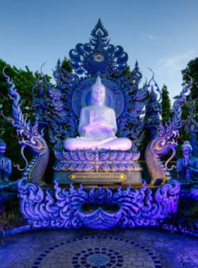 Blue-Temple-Wat-Rong-Suea-Ten-Chiang-Rai This image shows the magnificent Blue Temple, or Wat Rong Suea Ten, in Chiang Rai. The vibrant blue exterior and stunning murals inside reflect the temple’s spiritual significance and creative beauty, making it a popular destination for visitors.