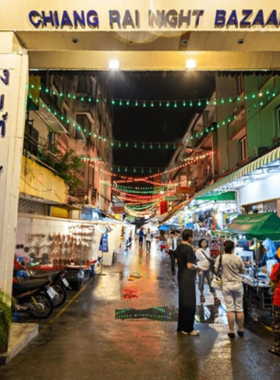 3. Chiang Rai Night Bazaar This image shows Chiang Rai Night Bazaar, bustling with colorful lights, street vendors, and shoppers. The vibrant market features traditional crafts, street food, and local culture, offering a lively atmosphere ideal for cultural and street photography.