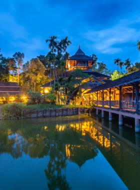14. Chiang Rai Lake (Kaew Lake) This image shows the peaceful Chiang Rai Lake with reflections of the sky and surrounding trees on its surface. The calm waters and serene environment make it an excellent spot for landscape and wildlife photography enthusiasts.