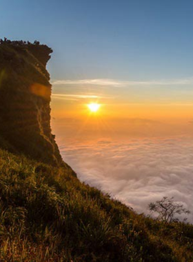 15. Phu Chi Fa This image shows Phu Chi Fa’s stunning sunrise view with mist-covered mountains in the distance. The breathtaking panoramic scene is a favorite among photographers capturing early morning light and dramatic natural landscapes.