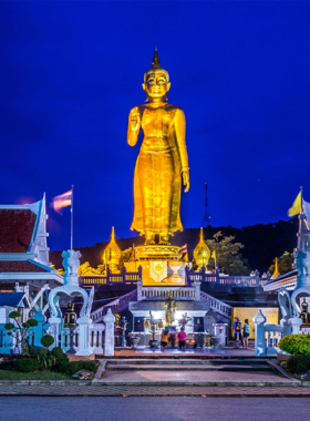 Hat Yai Municipal Park View This image shows that Hat Yai Municipal Park offers a peaceful setting with beautiful greenery, a golden Buddha statue on a hill, and a serene atmosphere. Visitors can relax, enjoy a cable car ride, and appreciate stunning panoramic views. The park is perfect for unwinding amidst nature and connecting with Thai culture.