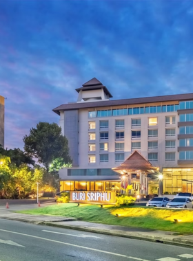 This image shows Buri Sriphu Boutique Hotel, showcasing its Thai heritage-inspired architecture. The image highlights luxurious amenities like a sparkling pool and a beautifully landscaped garden. The elegant interior design reflects a blend of tradition and modern comfort, making it ideal for those seeking a unique and upscale stay.