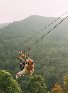 This image shows an exhilarating zip-lining adventure through the treetops of Ayutthaya’s jungle. Tourists glide through the air, enjoying a thrilling aerial view of the lush greenery below. The zip-line offers a unique perspective of the region’s natural beauty, providing an adrenaline-filled experience for adventure seekers. The thrill of the ride and the stunning views make it a perfect activity for those looking to add excitement to their Ayutthaya trip.