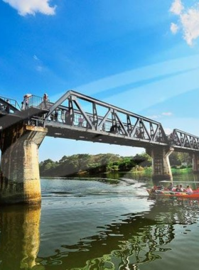 This image shows a thrilling adventure ride along the River Kwai, where tourists explore the famous Bridge over the River Kwai and surrounding historical sites. The scenic ride through the jungle is complemented by a deep dive into Thailand’s World War II history. Tourists can learn about the area’s significance while enjoying the natural beauty. This activity combines adventure, history, and scenic views, providing a well-rounded experience for both culture buffs and thrill-seekers.