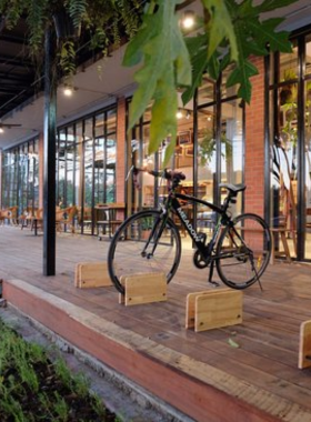 This image shows Burinda Restaurant in Ayutthaya, a riverside eatery with stunning views of local temples. The image captures the restaurant’s relaxed outdoor seating and fresh seafood offerings like grilled river prawns. The scenic location makes it a favorite among locals and visitors.