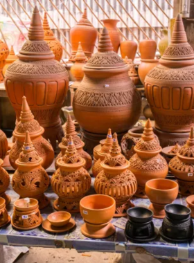 This image shows a local pottery village in Ayutthaya where artisans shape intricate clay designs. The traditional techniques and unique ceramic products highlight Thai craftsmanship and cultural heritage.