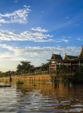 This image shows the Chao Phraya River during sunset, with golden reflections on the water and a temple in the background. The peaceful river scene captures the tranquility and natural beauty of Ayutthaya’s landscape.