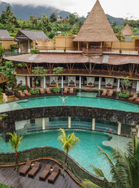 5. Wapa di Ume Sidemen This image shows Wapa di Ume Sidemen, an eco-friendly resort in Bali's tranquil Sidemen village. Surrounded by rice fields, the resort offers a relaxing escape with its organic meals, yoga sessions, and nature walks. Guests can unwind in luxurious villas with beautiful views of the surrounding landscapes, making it an ideal choice for eco-conscious travelers seeking peace and sustainability.