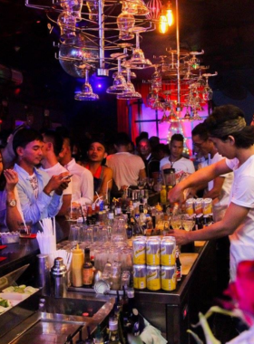 This image shows the inclusive, welcoming atmosphere at Bali Joe Bar, a popular LGBTQ+ friendly bar known for its lively drag shows and friendly crowd. The image captures guests enjoying drinks, performances, and a fun, supportive environment in Seminyak.