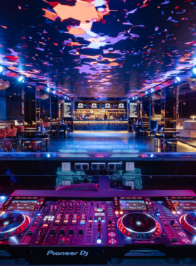 This image shows the sophisticated ambiance at ShiShi Nightclub and Izakaya Lounge in Seminyak. Guests are enjoying top international DJs in the nightclub area or relaxing with cocktails in the stylish lounge, making it an ideal spot for a luxurious night out in Bali.