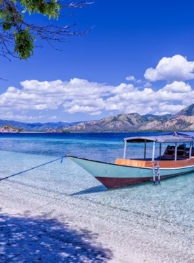 This image shows the serene beauty of Labuan Bajo in Flores, Indonesia. The vibrant blue waters and pristine beaches surround the idyllic islands, including the famous Komodo Island. Visitors can enjoy the spectacular views of the rugged hills, stunning beaches, and diverse marine life. This peaceful town is a gateway to Komodo National Park, where the iconic Komodo dragons roam freely. The crystal-clear waters are perfect for diving, snorkeling, and exploring the rich underwater biodiversity.