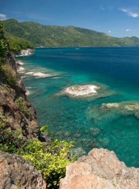 This image shows the rich history and culture of the Maluku Islands, also known as the Spice Islands. The colonial architecture in Ambon, coupled with lush greenery and calm waters, offers a glimpse into the region’s past as the center of the spice trade. The islands are home to unique cultural traditions, and visitors can explore historical sites while enjoying the serene environment. The stunning landscapes, combined with the local cultural richness, make the Maluku Islands a fascinating destination for history and culture lovers.