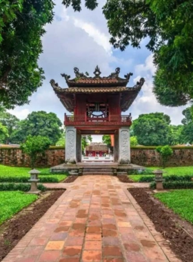 Temple of Literature in Hanoi This image shows visitors strolling through the peaceful courtyards of the Temple of Literature in Hanoi. The temple’s intricate architecture, ancient stone steles, and tranquil gardens create a serene atmosphere, showcasing the cultural and intellectual heart of Vietnam.