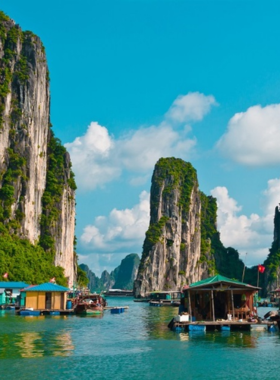 Sunset at Halong Bay This image shows the sun setting over the dramatic limestone karsts of Halong Bay, casting golden hues across the emerald waters. Whether on a cruise or enjoying the view from the shore, the breathtaking scenery captures the serene and magical atmosphere of one of Vietnam’s most iconic destinations.
