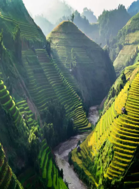 This image shows the breathtaking rice terraces of Sapa, nestled in the northern mountains of Vietnam. The terraces stretch across lush valleys, creating stunning landscapes with vibrant green hues. Local hill tribe cultures can be seen in the background, offering visitors a chance to connect with nature and experience local traditions during a peaceful hiking adventure.