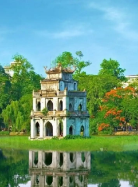 This image shows that Hoan Kiem Lake in the heart of Hanoi is a peaceful and serene escape. It features tranquil waters, lush green surroundings, and the Ngoc Son Temple on an island. Early morning visitors often enjoy a quiet stroll along the lake, making it a perfect spot for reflection and relaxation.