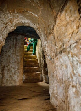 This image shows that the Cu Chi Tunnels are a significant historical site where visitors can explore the underground passageways used by Viet Cong soldiers during the Vietnam War. The tunnels, hidden beneath the earth, offer insight into the wartime history and the resilience of those who lived here.