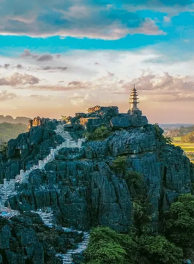 This image shows that Ninh Binh, often called the "Ha Long Bay on land," features striking limestone karsts and peaceful rivers. The Tam Coc boat ride takes visitors through caves and past rice fields, providing an unforgettable experience that highlights the natural beauty and serenity of the region.