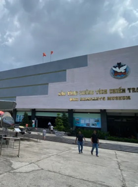 This image shows a poignant display inside the War Remnants Museum, with black-and-white photographs depicting the tragic impact of the Vietnam War. The museum houses tanks, helicopters, and other war relics, offering a glimpse into the devastating effects of the conflict. Visitors can learn about the resilience of the Vietnamese people, the horrors of war, and the ongoing efforts for peace through powerful exhibits that provide deep insights into the country’s history.