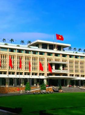 This image shows the grand Reunification Palace, also known as the Independence Palace, a historical landmark in Ho Chi Minh City. The palace, with its mid-century modern architecture, was the site where the Vietnam War officially ended in 1975. Visitors explore the elegant rooms, underground bunkers, and war relics, gaining insights into the political events that shaped Vietnam’s history and the country’s journey toward reunification.