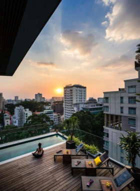 This image shows the rooftop bar at Au Lac Legend Hotel, offering guests a perfect spot to unwind while enjoying cocktails and panoramic city views. The hotel combines luxury with Vietnamese hospitality, offering a range of services such as a spa, a pool, and afternoon tea. The spacious rooms add comfort to your stay, making it an excellent choice for a luxurious city retreat.