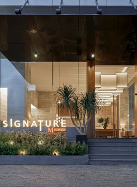 This image shows the modern and stylish Signature By M Village Le Thanh Ton hotel, located in the vibrant "Japan Town" of Ho Chi Minh City. The hotel’s chic rooms, pool, and restaurant serve both local and international dishes. Guests can also enjoy laundry services and explore the city with available city tours, ensuring a convenient and trendy stay.