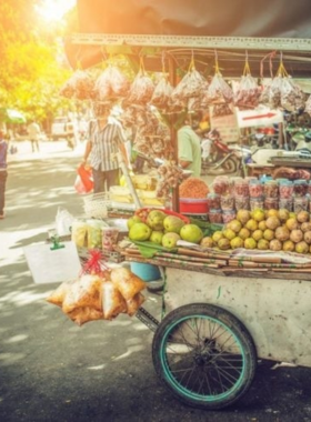 This image shows that Dong Ba Market in Hue is a bustling hub of local life where visitors can find everything from souvenirs to fresh produce. The image captures colorful stalls filled with fruits, vegetables, traditional conical hats, and local crafts. Vendors and shoppers in the market bring energy to the scene, showcasing the lively and authentic cultural experience that makes this market a must-visit destination in Hue.