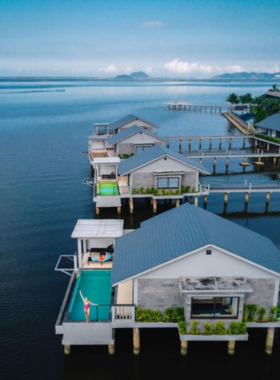 This image shows Vedana Lagoon Resort & Spa, a luxurious resort featuring overwater villas and breathtaking lagoon views. The photo highlights its unique architecture, serene infinity pool, and private balconies overlooking the water. Guests can enjoy spa treatments, lagoon tours, and fresh seafood dishes at the on-site restaurant. It’s an idyllic retreat for travelers seeking a combination of nature and luxury in Hue.