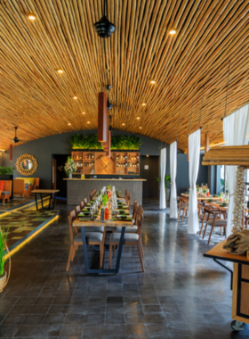 This image shows Spice Viet Restaurant in Hue, with a variety of flavorful Vietnamese dishes spread across the table. The image captures a cozy, chic dining space with vibrant dishes like crispy spring rolls and rich soups. The welcoming atmosphere is perfect for a laid-back meal with friends or family, offering both quick bites and leisurely dining experiences. Spice Viet is known for its fresh ingredients and delicious food, making it a must-visit in Hue for food lovers.