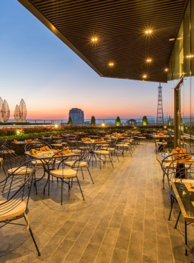 This image shows Sky Bar located on the 34th floor in Hue, offering stunning views of the city’s skyline and the Perfume River. The stylish ambiance combined with modern music sets the perfect atmosphere for a fun evening. The sunset views here are breathtaking, making it an unforgettable experience. This rooftop bar is ideal for sipping cocktails with friends while enjoying the serene beauty of the city.