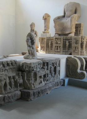 This image shows a collection of ancient artifacts displayed in the Cham Museum in Da Nang. Intricate stone carvings and sculptures from the Cham civilization are showcased in the museum’s galleries. The image captures the impressive craftsmanship and historical significance of these pieces. Visitors can be seen admiring the exhibits, learning about the rich history of Vietnam's ancient cultures while staying cool in the museum’s climate-controlled environment.