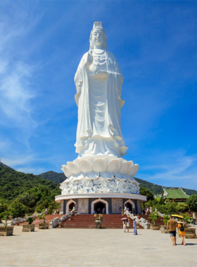 This image shows Son Tra Peninsula in Da Nang, Vietnam. The peninsula is known for its stunning natural beauty, with lush forests, winding trails, and serene beaches. The image captures both the rugged landscape and the rich diversity of wildlife, including the endangered red-shanked douc langurs. Visitors can be seen hiking, taking in the views, or simply enjoying the natural surroundings. Son Tra Peninsula is an ideal location for nature lovers and adventure enthusiasts looking for a peaceful yet thrilling experience.