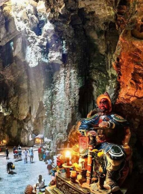 This image shows the stunning view from the top of Marble Mountains, where limestone hills represent the five elements: metal, wood, water, fire, and earth. The image captures the natural beauty of the area, highlighting the caves, tunnels, and pagodas tucked within the mountains. Visitors can enjoy a panoramic view of Da Nang city and the coastline, making it a peaceful and spiritual escape. It’s a perfect blend of adventure and cultural significance, offering a serene atmosphere surrounded by nature.