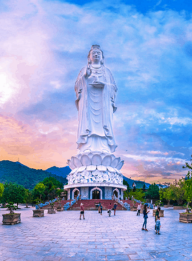 This image shows the impressive Lady Buddha statue at Linh Ung Pagoda on the Son Tra Peninsula. Standing 67 meters tall, the statue symbolizes protection and peace for Da Nang. The image also captures the surrounding peaceful gardens and stunning architecture, offering a moment of reflection. The tranquil setting of the pagoda, with its intricate carvings and views of the coastline, makes it an ideal spot for visitors seeking spiritual calm and relaxation in a serene atmosphere.