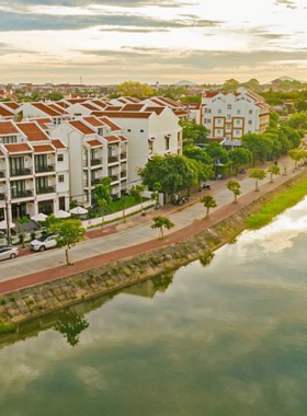 This image shows Homestay Riverside, a charming accommodation near a peaceful river. The traditional-style home offers a warm and welcoming atmosphere with lush gardens and cozy seating areas. Guests can enjoy authentic Vietnamese meals, rent bicycles, and explore the scenic riverside surroundings. It’s an ideal spot for those seeking an authentic, eco-friendly, and tranquil experience that feels like home.