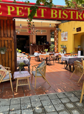 This image shows Le Petit Bistro in Hoi An, a charming French restaurant offering classic French dishes in a cozy setting. Known for its impeccable service and attention to detail, the bistro serves flavorful meals like chicken cordon bleu and rich soups. With its intimate atmosphere and quaint French décor, Le Petit Bistro is a great choice for a romantic meal or a peaceful dinner away from the busy streets. End your meal with their delicious crème brûlée for a true taste of France.