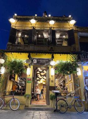 This image shows Faifo Coffee in Hoi An, a popular café known for its rooftop views of the ancient town. The café offers a variety of coffee options, from strong Vietnamese brews to smooth coconut coffee, perfect for coffee lovers. The charming rustic décor and picturesque views of Hoi An's skyline make it a great spot to relax and enjoy your drink. Whether you’re sipping coffee on the rooftop or lounging inside, Faifo Coffee is the perfect place to unwind and take in the beauty of the city.