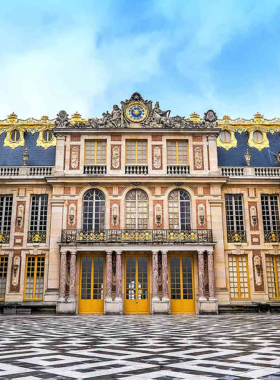 This image shows the stunning gardens of the Palace of Versailles, with neatly manicured lawns, symmetrical flowerbeds, and grand fountains. The palace’s opulent architecture is visible in the background, reflecting the grandeur of French royalty. Versailles is renowned for its lavish design, including the famous Hall of Mirrors. The gardens are a masterpiece of landscaping, offering visitors a peaceful place to explore the palace grounds and enjoy the magnificent beauty of this historical landmark.