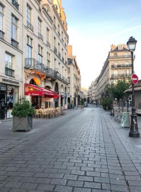 This image shows the vibrant and fashionable streets of Le Marais, a historic district in Paris known for its trendy shops, art galleries, and cafés. The narrow streets are lined with beautiful old buildings, creating a charming atmosphere that blends modern style with rich history. Le Marais is a popular area for both locals and tourists, offering an eclectic mix of boutiques, cultural attractions, and a lively atmosphere. The image perfectly captures the energy and allure of this Parisian neighborhood.