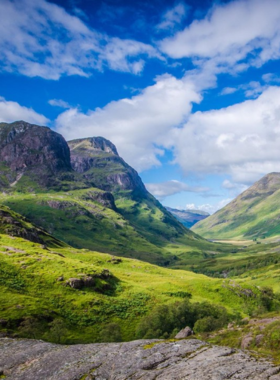 This image shows a scenic drive through the rugged beauty of the Scottish Highlands. Towering mountains, shimmering lochs, and picturesque villages create a postcard-worthy landscape. Highlights include the serene waters of Loch Ness and the historic Eilean Donan Castle, surrounded by mist and rolling hills that define Scotland’s wild charm.