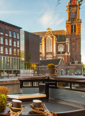 This image shows the Anne Frank House in Amsterdam, Netherlands, a historic site where visitors learn about Anne Frank’s life and legacy. The modest building is set along a peaceful canal, and the museum offers a glimpse into the secret annex where Anne and her family lived in hiding during World War II.