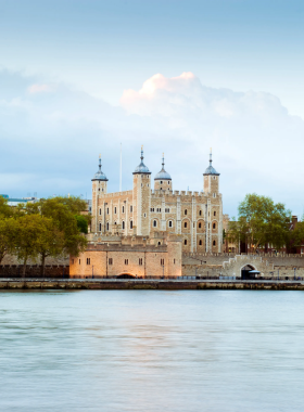 This image shows the Tower of London, a historic fortress and former royal palace located on the banks of the River Thames. Visitors can explore the iconic White Tower, discover the Crown Jewels, and learn about the tower's fascinating past, including its use as a prison. The Tower of London is a must-see historical landmark where centuries of British history come alive, with plenty of exhibits and opportunities for exploration, offering a glimpse into medieval England.

