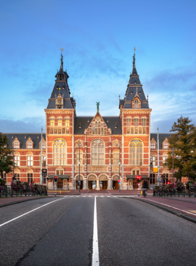 This image shows the majestic Rijksmuseum in Amsterdam, home to priceless works of art from the Dutch Golden Age. Inside, visitors can explore masterpieces like Rembrandt's Night Watch and Vermeer's Milkmaid, along with historical artifacts, ship models, and beautiful gardens. The stunning architecture of the museum adds to its charm. It’s a perfect destination for art lovers, with an array of exhibits that provide an in-depth look at Dutch culture and history. Be sure to book tickets online to avoid the long queues.