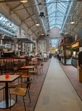 This image shows the lively Foodhallen in Amsterdam, a famous indoor food market offering a wide range of Dutch delicacies and international cuisines. From crispy Dutch bitterballen to sushi, tacos, and burgers, there’s something for everyone. The market’s communal tables create a social atmosphere where you can enjoy various dishes and drinks. Don’t miss the delicious stroopwafels (Dutch caramel waffles), a favorite treat that’s addictive. Foodhallen is a must-visit for food lovers looking to sample a variety of flavors.