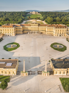 This image shows Schönbrunn Palace, a magnificent baroque palace in Vienna. Once the summer residence of the Habsburgs, it is one of Austria's most visited tourist attractions. The palace is surrounded by beautiful gardens, fountains, and statues, offering a picturesque setting. Visitors can explore the opulent rooms inside, and the Gloriette at the top of the gardens provides a stunning view of the city. This UNESCO World Heritage site is a must-see when in Vienna.

