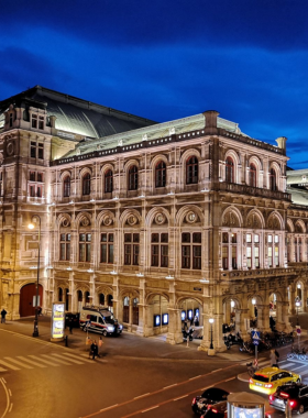 This image shows the Vienna State Opera, one of the world’s most famous opera houses. The grand architecture and rich history make it an iconic cultural landmark in Vienna. Visitors can enjoy spectacular opera performances or take a guided tour to learn more about its history. The opulent interiors, including the ornate staircases and chandeliers, create an unforgettable atmosphere. Whether you're a fan of opera or just appreciate beautiful architecture, the Vienna State Opera is a must-visit venue.