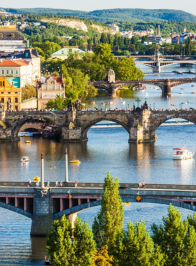 This image shows the iconic Charles Bridge in Prague, Czech Republic, a historic structure that connects the Prague Castle with the Old Town. The 14th-century bridge is lined with statues of saints and provides stunning views of the Vltava River. Tourists often stroll across the bridge while admiring its beauty, and it’s particularly magical at sunrise or sunset when the bridge is quieter and the light creates a serene atmosphere. Charles Bridge is one of the most photographed landmarks in Prague, perfect for capturing a piece of history.