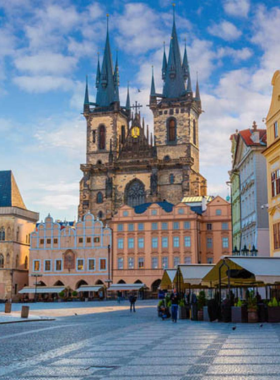 This image shows Old Town Square in Prague, a historic public space surrounded by beautiful buildings, cafes, and shops. At the center of the square stands the famous Astronomical Clock, drawing crowds every hour to watch its animated performance. The square is a lively spot where locals and tourists mingle, offering a great opportunity to experience the heart of Prague’s Old Town. The vibrant atmosphere, colorful architecture, and rich history make it a must-visit destination for anyone exploring Prague.