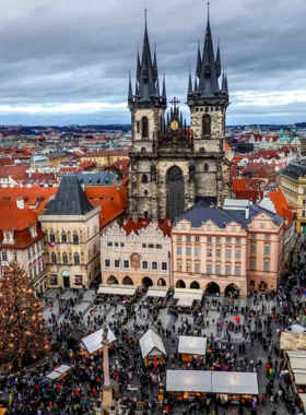 This image shows a local market in Prague, bustling with fresh produce, handmade goods, and unique souvenirs. Markets like Havelska Market are a great place to shop for local products, ranging from Czech food and crafts to fresh fruits and vegetables. Visitors can immerse themselves in the vibrant atmosphere while browsing for gifts or enjoying traditional Czech treats. The markets offer a wonderful glimpse into everyday life in Prague and provide an authentic shopping experience for tourists."